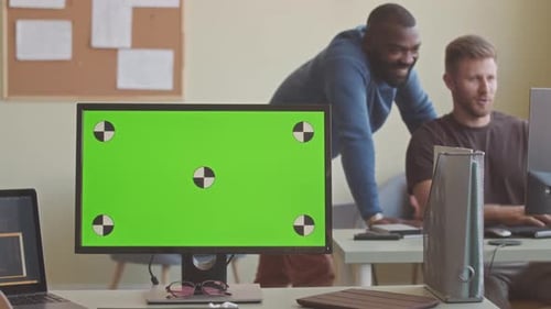 Diverse Programmers Coworking in Office