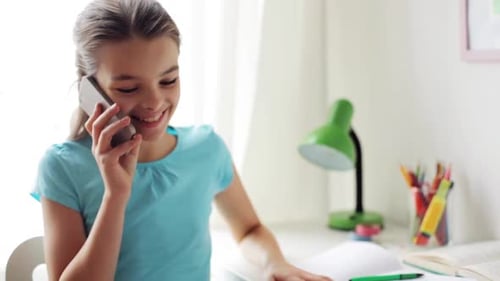 Girl Happily Talking on Phone at Desk