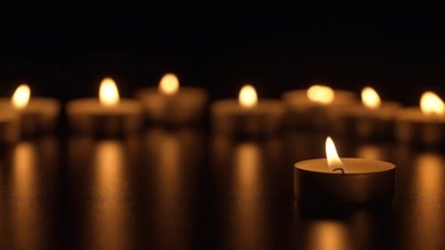 Burning Candles in Darkness