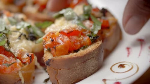 close up toasted bread brochetas with tomatoes, garlic, onion, Mediterranean diet, carbs