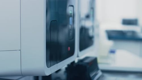 Close-up Female Research Scientist's Hand Takes Test Tube with Blood Sample and Places it Into Medi
