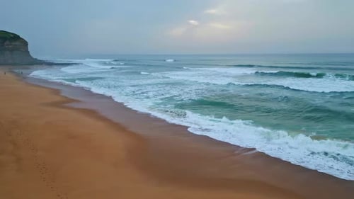 Foamy Waves Covering Sandy Coast at Gloomy Day Closeup Ocean Surf Rolling Beach