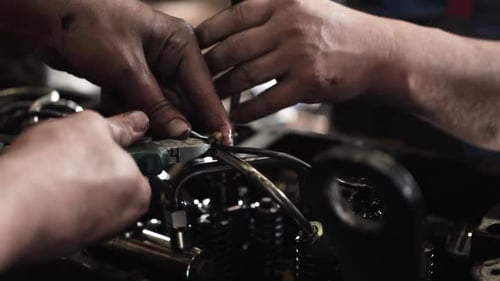 Close Up of Mechanics Working on Car Engine