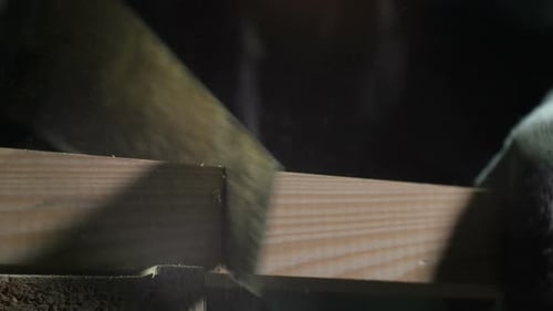 Closeup Worker in Gloves Saws Fast Wooden Board Part