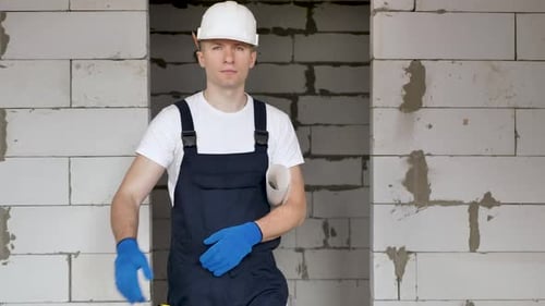 Portrait of the Architect Builder Studying the Layout Plan of the Premises