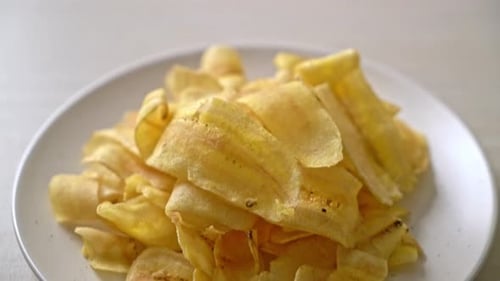Close Up of Crispy Banana Chips on Plate