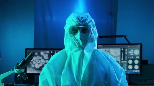 Researcher in Protective Suit in Science Lab