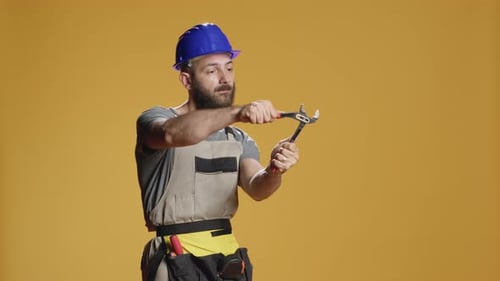 Construction Craftsman Working with Steel Wrench on Renovation