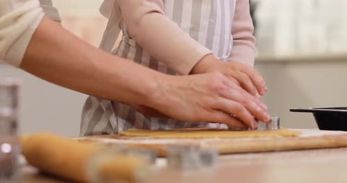 Mother and Little Child Daughter Cutting Cookies of Raw Gingerbread Dough