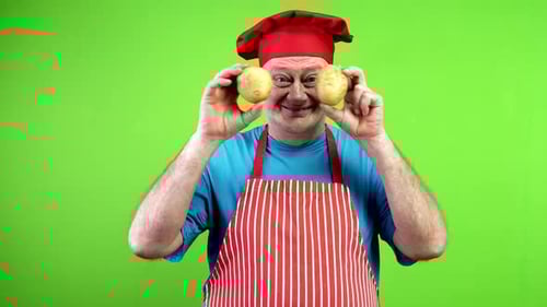 Comical Chef with Potatoes on Green Screen