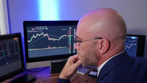 Stock broker forex crypto trader in office analysing charts