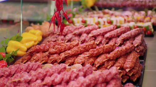 Close up traditional turkish raw kebab in a window shop for sale.