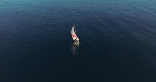 Aerial View Yacht Sailing on Open Sea at Windy Day Aerial Sun Shine Over White Sail Boat at Ocean