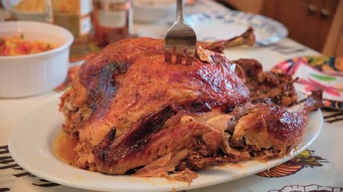 Roasted Thanksgiving Turkey Dish During Dinner Celebrating Holiday At Home Wide Shot Footage