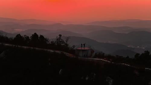 Scenic Mountain City View at Colorful Sunrise