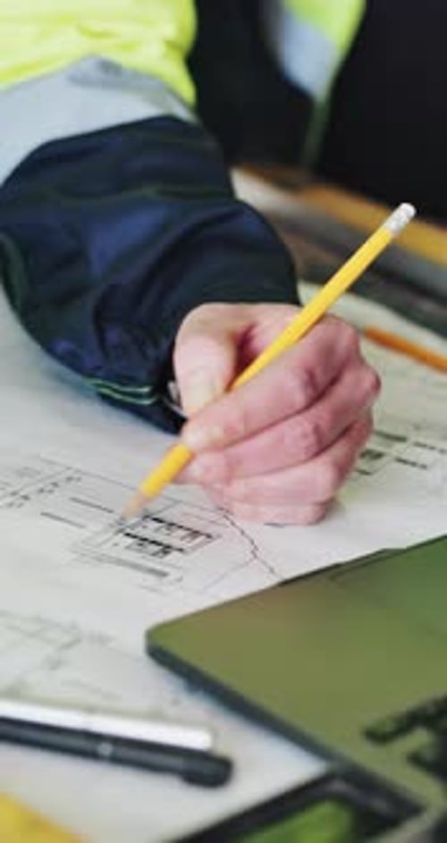 Hands, engineer and writing with team for floor plan, review or real estate development