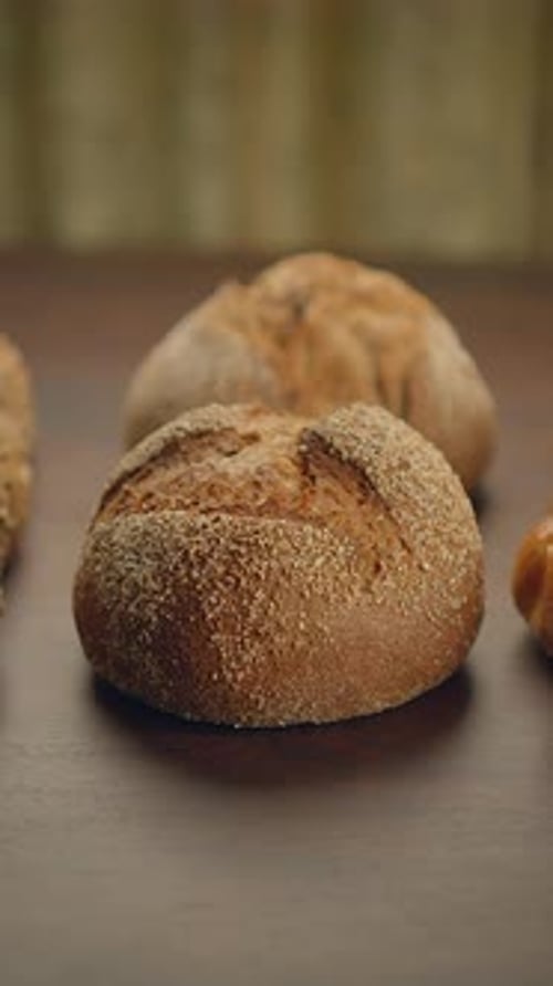 Fresh Bread Rolls on Rustic Wooden Surface