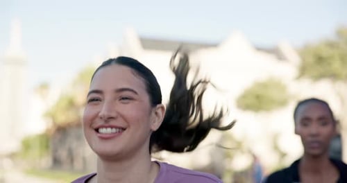 Women Jogging Together for Fitness in Urban Setting
