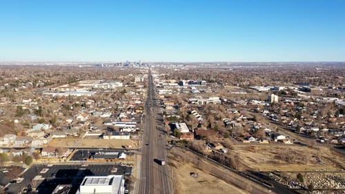 Traffic along Colfax Blvd., Lakewood CO. Denver can be seen in the distance.