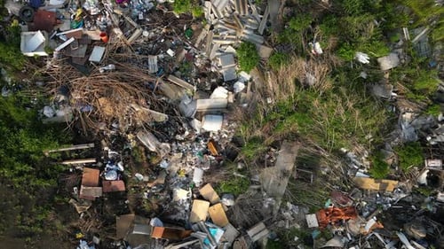 Aerial View Capturing Expansive Landfill Site Highlighting Widespread Waste Accumulation and Severe