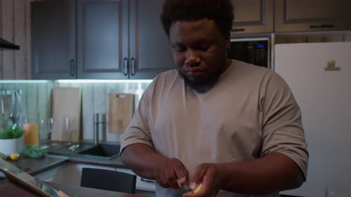 Adult Slicing Apple on Cutting Board Indoors