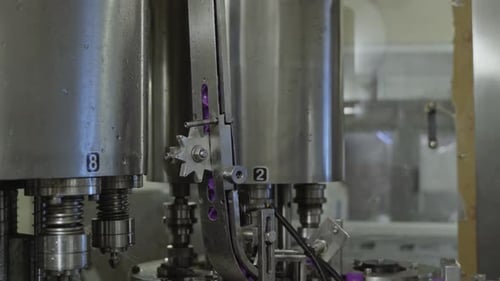 plastic bottle caps unlabelled moving on the conveyor system using advanced automated robotic in a d