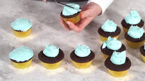 Decorating Chocolate Cupcakes with Buttercream Frosting and Rainbow Candy