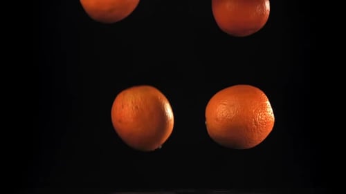 Oranges Fall on the Table Filmed on a Highspeed Camera at 1000 Fps