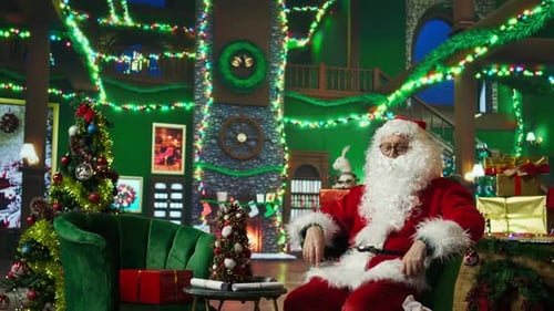 Man dressed as Santa Claus puts on gift bag