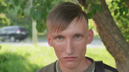 Nervous Commuter Glances Nervously At Passing Vehicles Nearby Tense City Dweller Keeps Vigilant