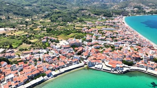 Drone footage of village and colorful sea waters on Samos, Greece