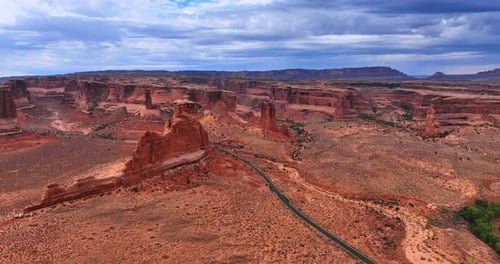 Flying closer to the highway crossing the arid desert.