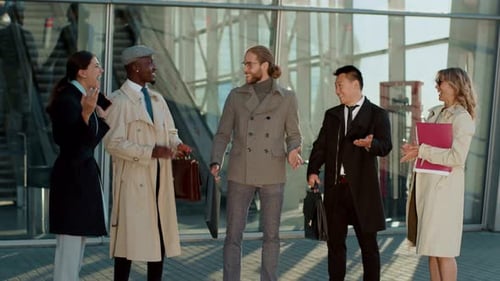 Business Team Congratulates Success Outside Building