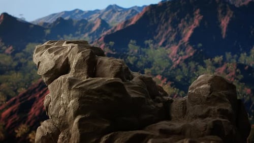 Rugged Rocky Ledge Overlooks a Breathtaking Mountain Range