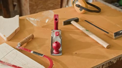 Woodworking Tools Including Hammer, Hand Plane, Coping Saw and Safety Glasses