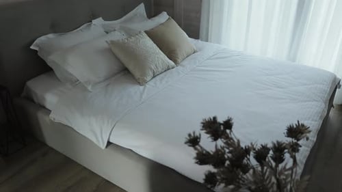 Bed with White Bedding in Modern Bedroom Bed Near the Window with Tulle Home Decor and Interior