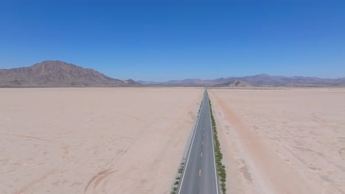 Endless Road to Horizon Through the Desert Valley Aerial View of a Desert