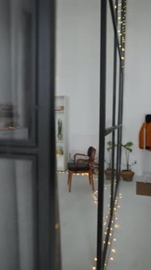 Woman Runs Up to the Christmas Tree and Rejoices at the Gifts Nearby