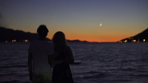 Romantic Couple Looking At The Beautiful Sunset Over The Adriatic Sea On Croatian Island. Selective