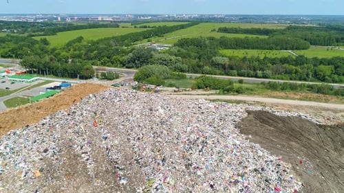 Aerial View of Large Garbage Landfill Trash Dump Flocks of Birds Circling Over the Garbage Dump