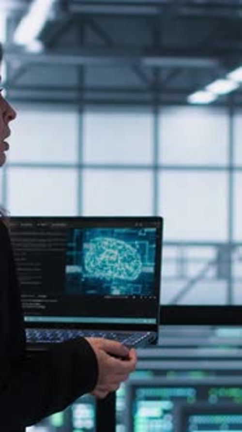 Vertical Video Programmers Coding on Laptop Using Artificial Intelligence in Server Farm