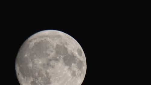 Zooming Close-up of the Moon in Dark Night Sky