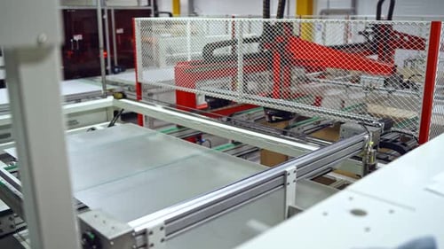 Solar panel is moving on a conveyor belt.