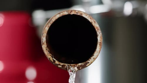 Waste Water Pipes Close Up on Factory Pouring Gasolin