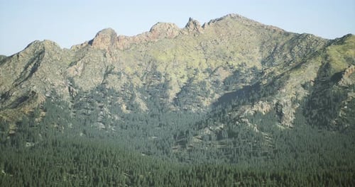 Majestic Mountain Range with Lush Forest in Serene Natural Landscape