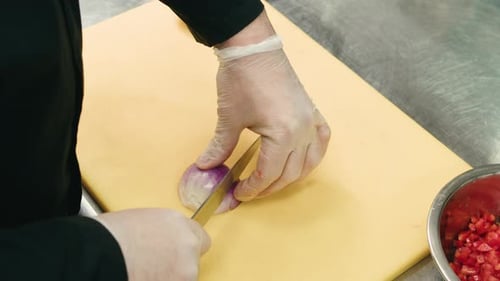 Chef Chopping a Red Onion with a Knife on the Cutting Board Macro Close Up of Cutting Red Onion on