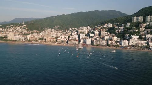 Aerial of Puerto Vallarta romantic zone pacific coastline of old town in Mexico with sailboat moored
