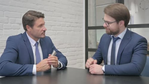 Businessman Giving Money and Shaking Hand after Deal