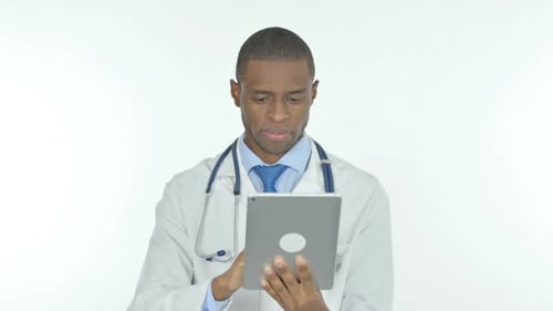 Doctor Using Tablet in Hospital Setting
