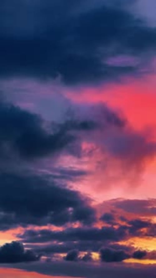 Vibrant sunset clouds with pink and orange colors. Abstract sky background featuring